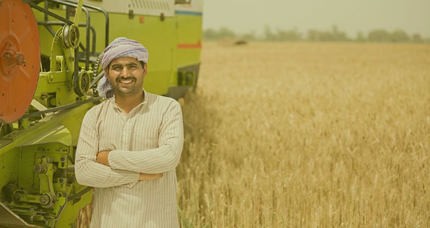 Happy farmer using VISHAL 435 Brisk Plus Combine Harvester